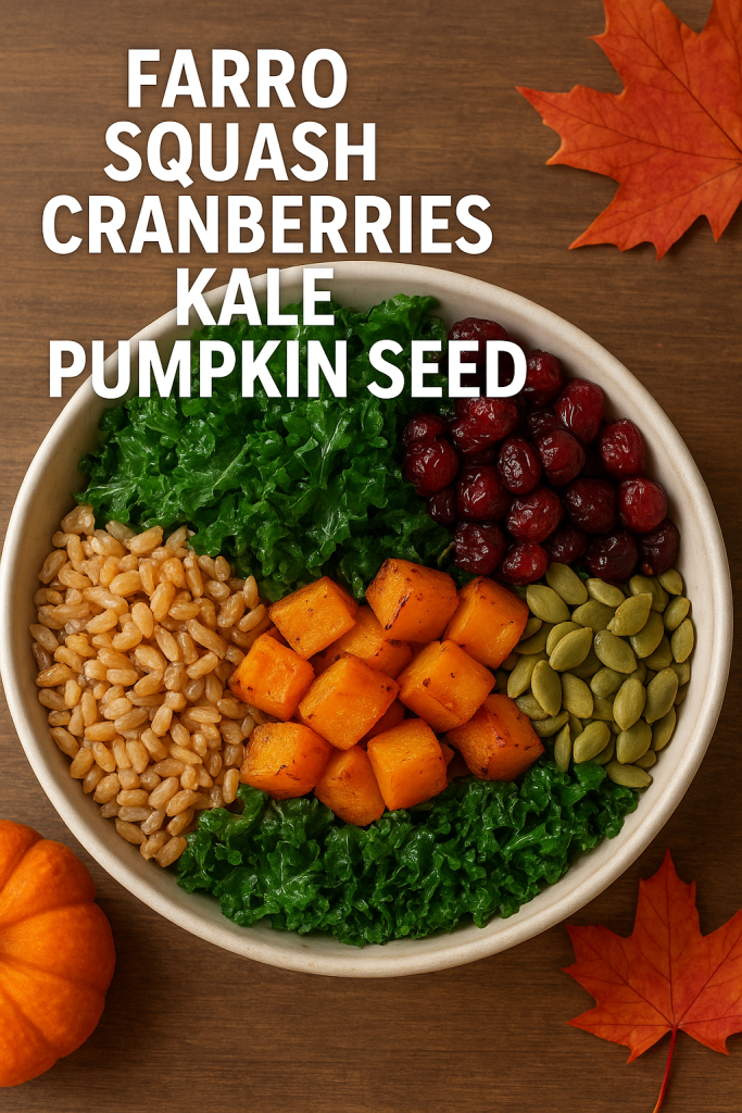 A bowl containing farro, squash, cranberries, kale, and pumpkin seeds, with an autumn leaf in the background. 
